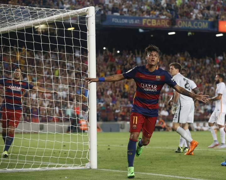 Barcelona's Neymar celebrates a goal against AS Roma during a friendly match at Camp Nou stadium in Barcelona
