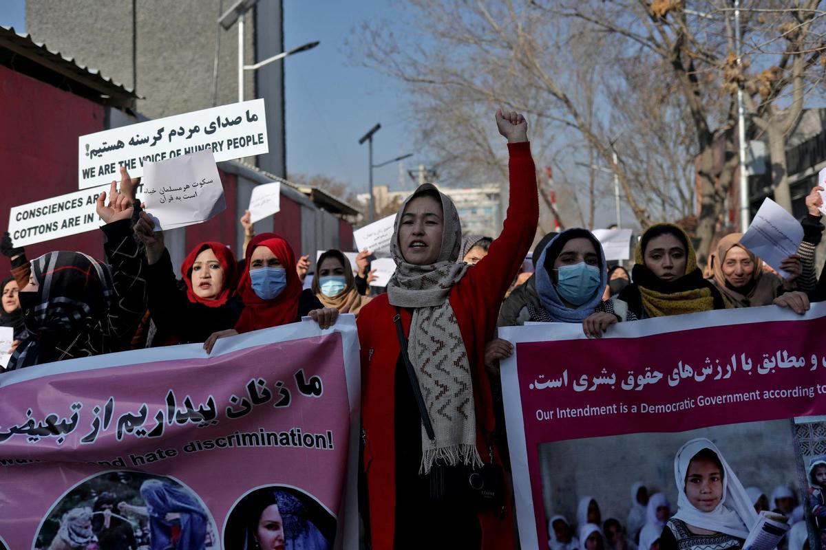 FILE PHOTO: Afghan women shout slogans during a rally to protest against what the protesters say is Taliban restrictions on women, in Kabul