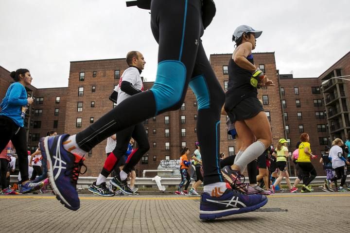 Runners exit the Verrazano-Narrows Bridge as they enter the borough of Brooklyn after the start of the New York City Marathon in New York