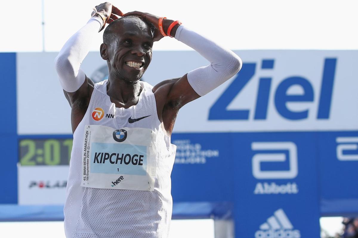 BERLIN, GERMANY - SEPTEMBER 16:  Eliud Kipchoge of Kenia celebrates after he crosses the finishing line to win the Berlin Marathon 2018 in a new world record time of 2:01:40 hours on September 16, 2018 in Berlin, Germany.  (Photo by Maja Hitij/Bongarts/Getty Images)