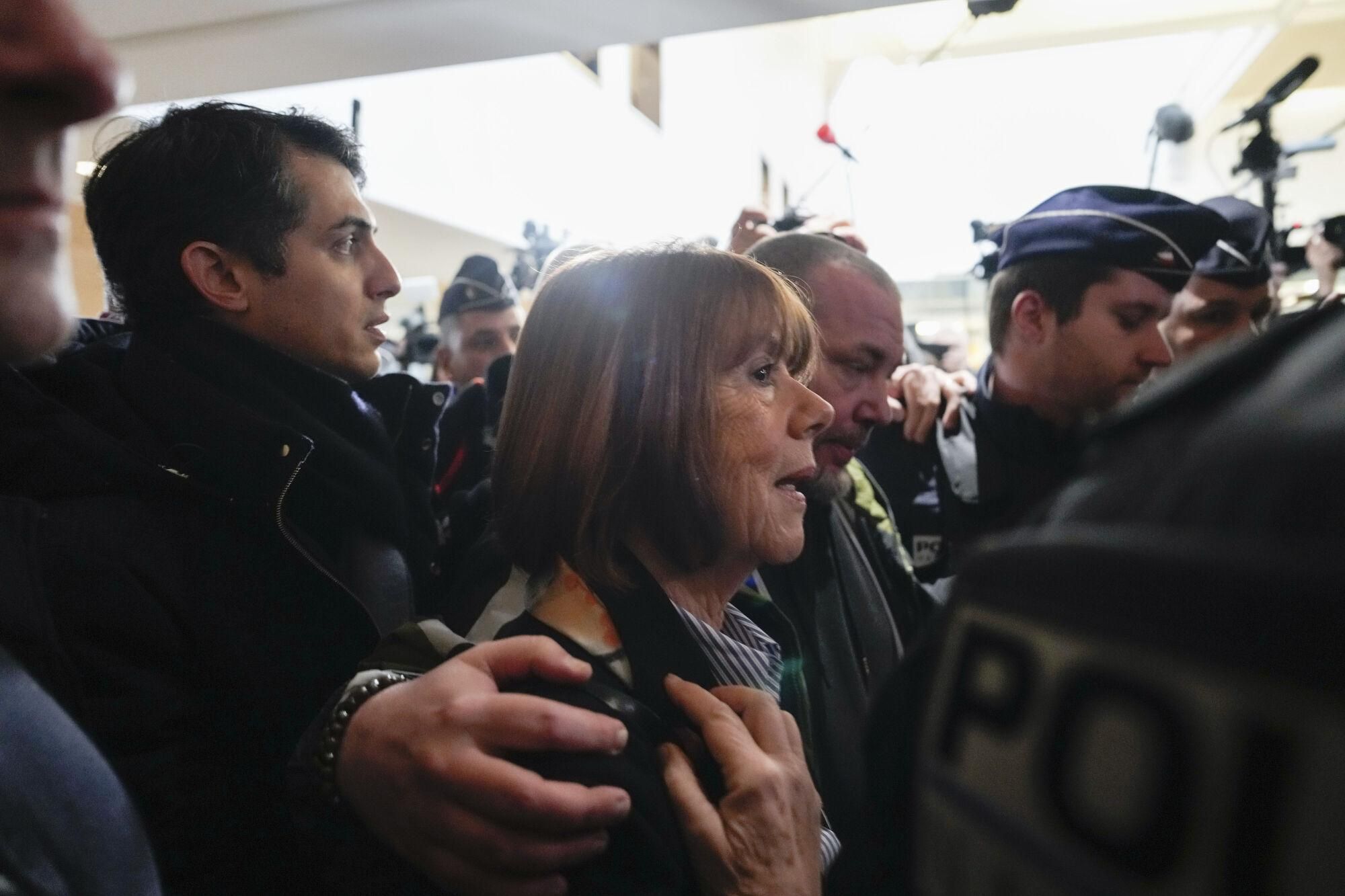 Gisele Pelicot, who was allegedly drugged by her now former husband so that he and others could assault her, arrives at the court house in Avignon, southern France, Thursday, Dec. 19, 2024. (AP Photo/Lewis Joly) Associated Press/LaPresse. EDITORIAL USE ONLY/ONLY ITALY AND SPAIN