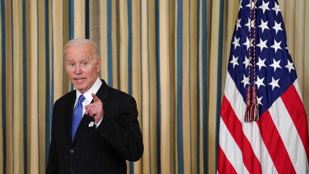 FILE PHOTO: Biden signs Postal Service Reform Act in Washington