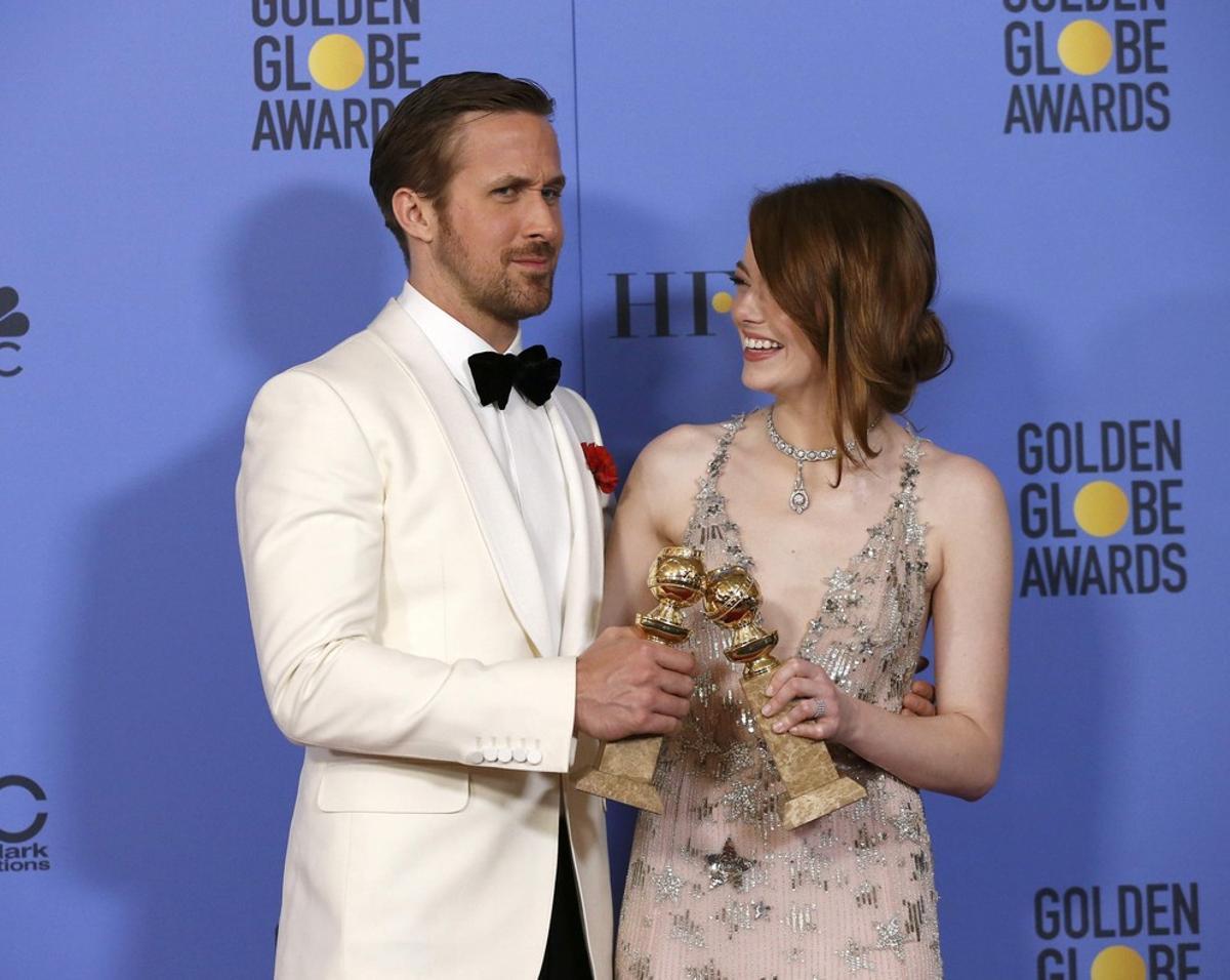 Ryan Gosling and Emma Stone pose with their awards for Best Performance by an Actor in a Motion Picture - Musical or Comedy and Best Performance by an Actress in a Motion Picture - Musical or Comedy for their roles in La La Land during the 74th Annual Golden Globe Awards in Beverly Hills, California, U.S., January 8, 2017.  REUTERS/Mario Anzuoni