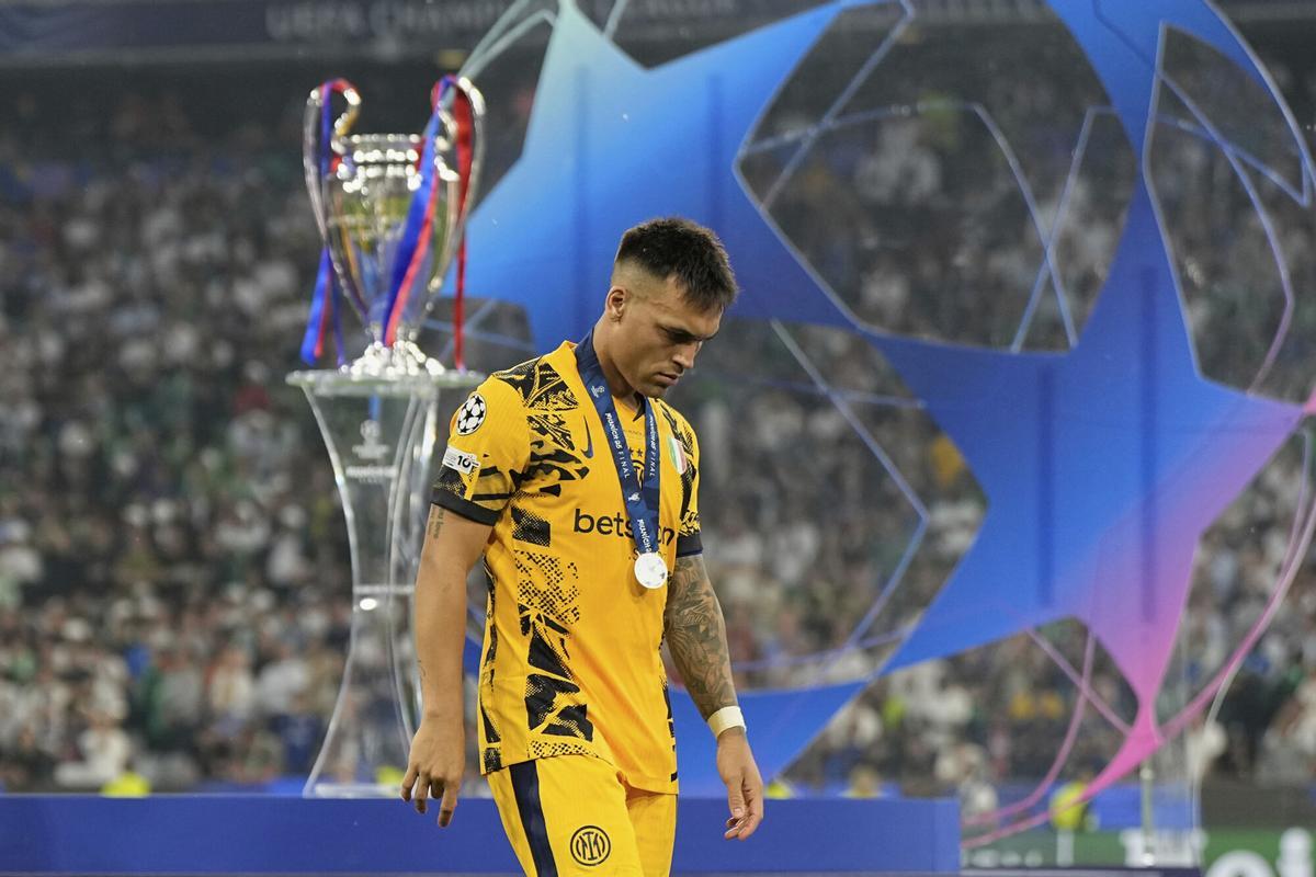 Inter Milan's Lautaro Martinez walks in dejection at the end of the Champions League final soccer match between Paris Saint-Germain and Inter Milan at the Allianz Arena in Munich, Germany, Saturday, May 31, 2025. (AP Photo/Martin Meissner)