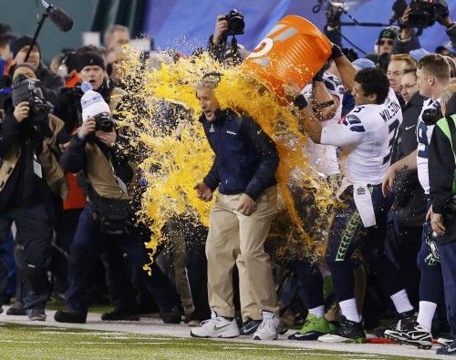 Seahawks head coach Carroll gets gatorade dumped on him in celebration near the end of the fourth quarter against the Broncos during the NFL Super Bowl XLVIII football game in East Rutherford