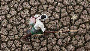 abertran2919766 a shepherd walks on the dry bed of the himayatsagar reservoi170803123027