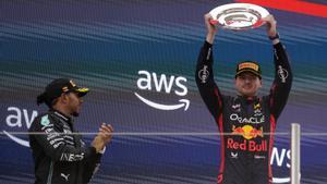 Dutch driver Max Verstappen (R) of Red Bull Racing jubilates on the podium with British Lewis Hamilton (L-2nd) of Mercedes after winning the Formula One Spanish Grand Prix at Barcelona-Catalunya circuit in Montmelo, Barcelona, Spain, 04 June 2023.  EFE/ Enric Fontcuberta