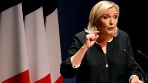 FILE PHOTO: France’s far-right leader Marine Le Pen delivers a speech for the next year’s municipal elections in an end-summer annual address to partisans in Frejus