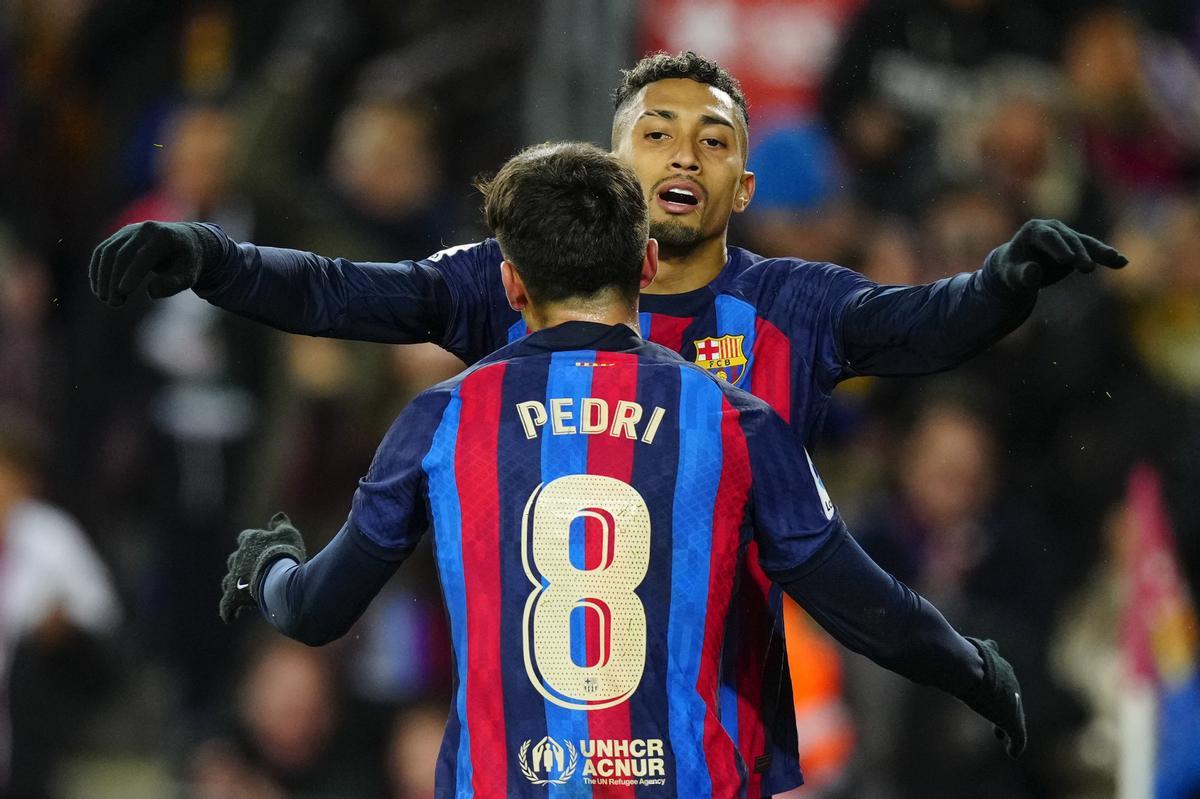 FC Barcelona’s Pedri (L) celebrates with teammate Raphinha after scoring the 1-0 lead during a Spanish LaLiga soccer match between FC Barcelona and Getafe CF at Camp Nou stadium in Barcelona, Spain, 22 January 2023. EFE/ Enric Fontcuberta