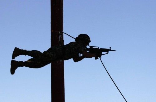 A Mexican marine slides down a zipline during training at a military base in Chetumal
