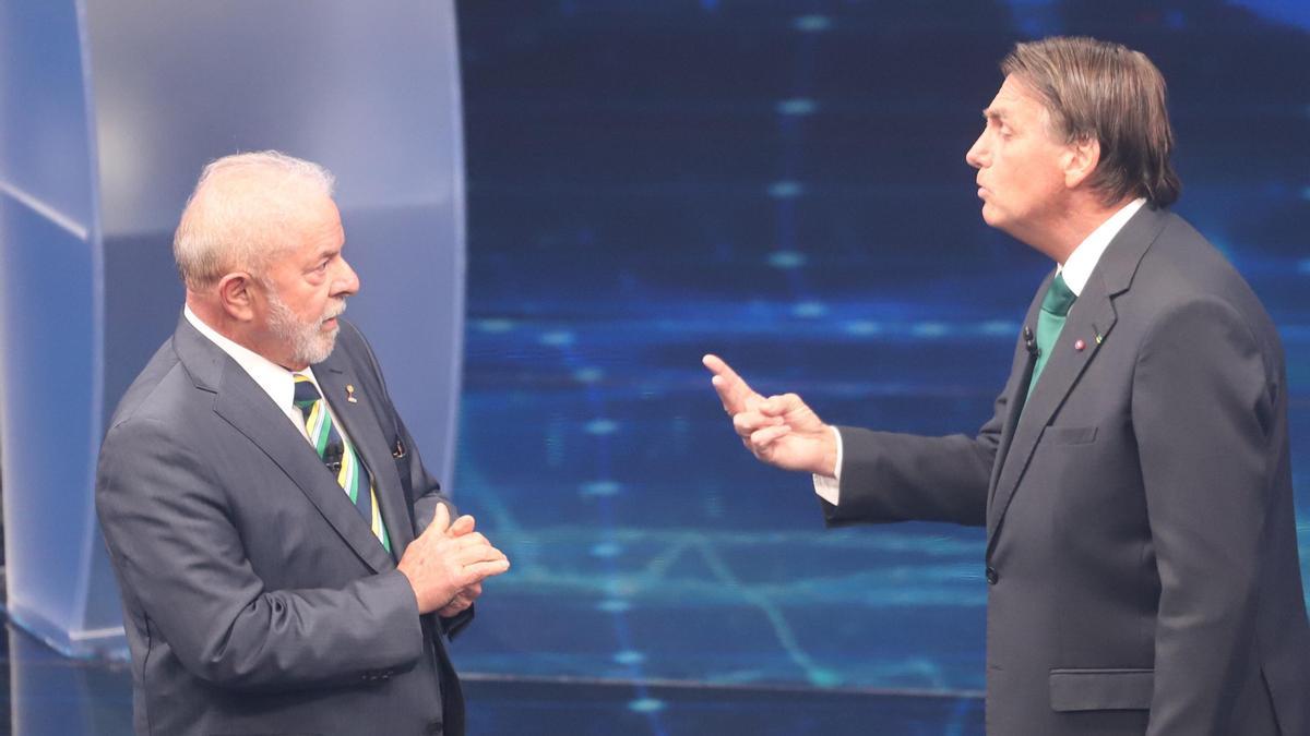 Luiz Inácio Lula da Silva y Jair Bolsonaro en el último debate electoral.