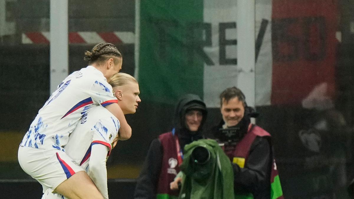 Norway's Erling Haaland, right, celebrates with Thelo Aasgaard after scoring his side's second goal during the 2026 World Cup Group I qualifier soccer match between Italy and Norway in Milan, Italy, Sunday, Nov. 16, 2025. (AP Photo/Luca Bruno)