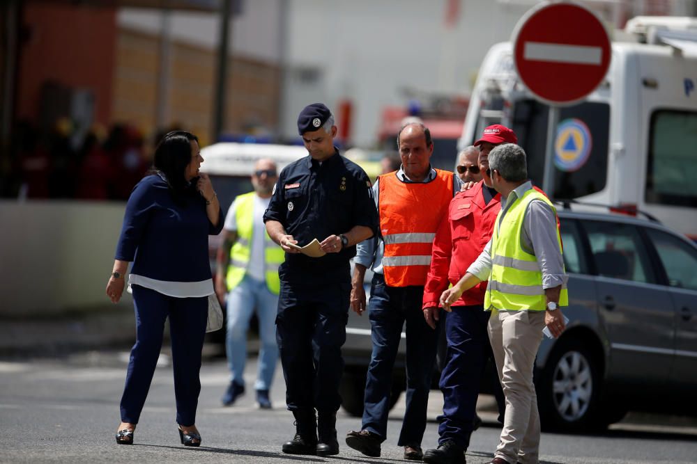 Members of civilian protections leave the site ...