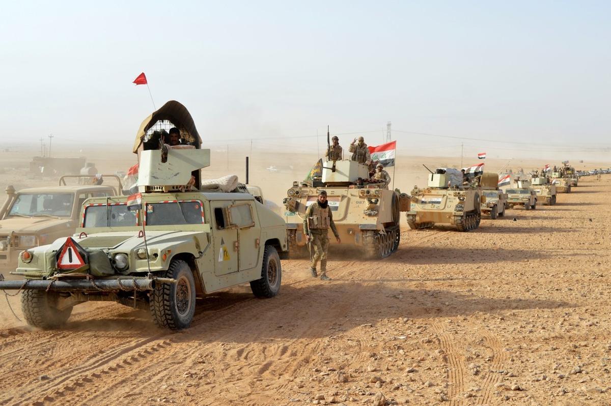 Iraqi forces vehicles are seen after they captured Rawa town  the last remaining town under Islamic State control  Iraq November 17  2017  REUTERS Stringer