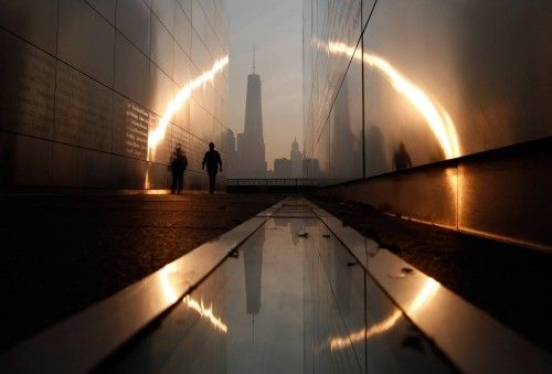 A man walks through the 9/11 Empty Sky memorial across from New York's Lower Manhattan and One World Trade Center in Liberty State Park