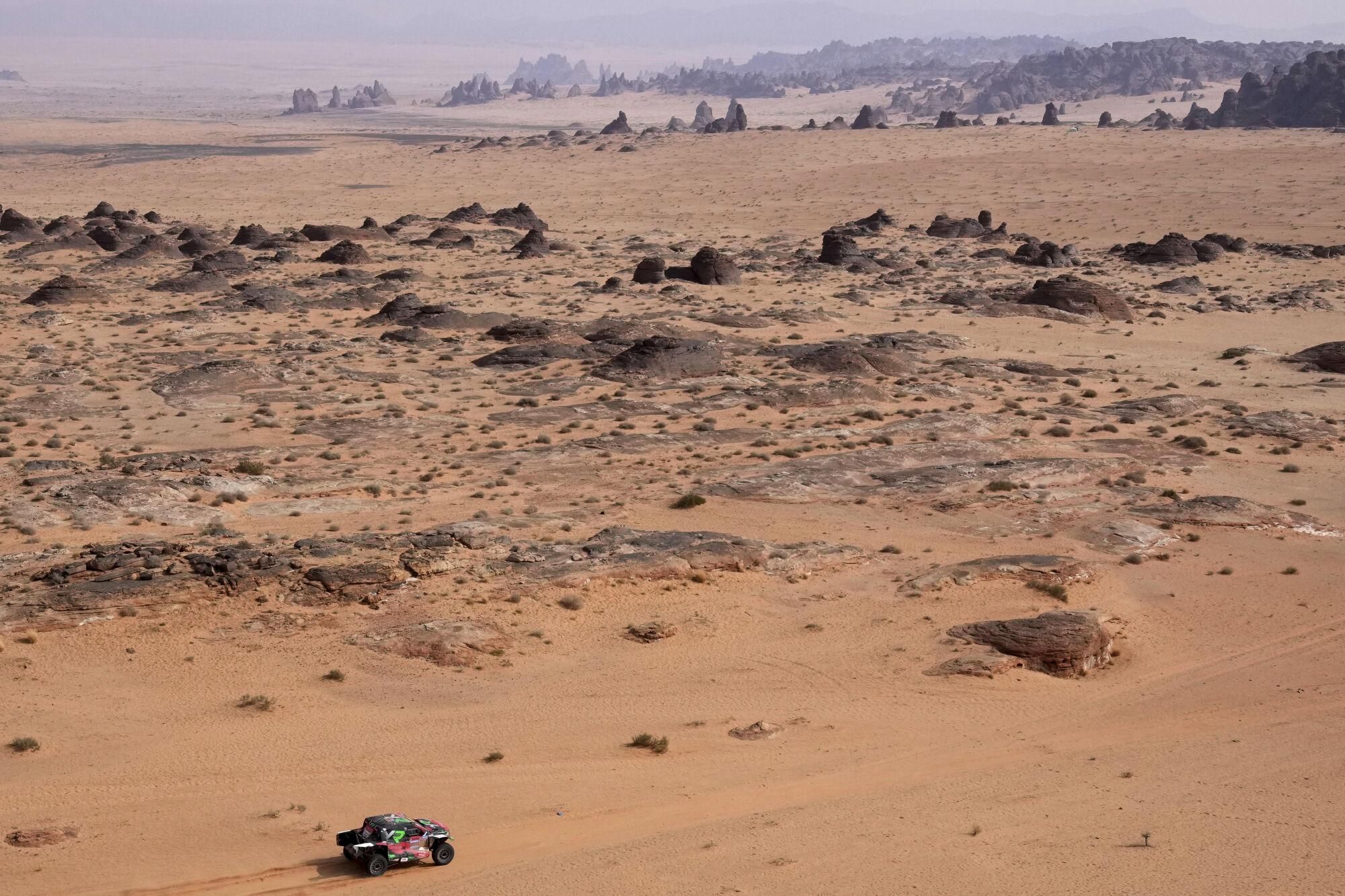 Driver Yazeed Al Rajhi and co-driver Timo Gottschalk drive during the fifth stage of the Dakar Rally between Alula and Hail, Saudi Arabia, Thursday, Jan. 9, 2025. (AP Photo/Christophe Ena). EDITORIAL USE ONLY / ONLY ITALY AND SPAIN