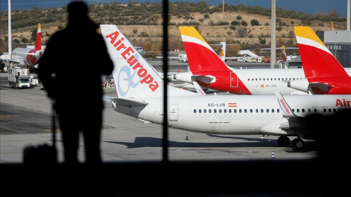 FILE PHOTO  Iberia and Air Europa airplanes are parked at a tarmack at Adolfo Suarez Barajas airport amid the coronavirus disease (COVID-19) pandemic in Madrid  Spain  December 15  2020  REUTERS Susana Vera File Photo