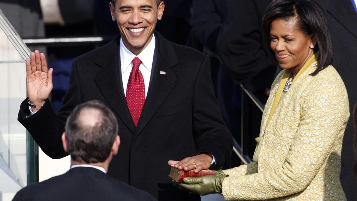 Barack Obama takes the Oath of Office as the 44th President of the United States as he is sworn in by U.S. Chief Justice John Roberts with his wife Michelle by his side during the inauguration ceremony in Washington