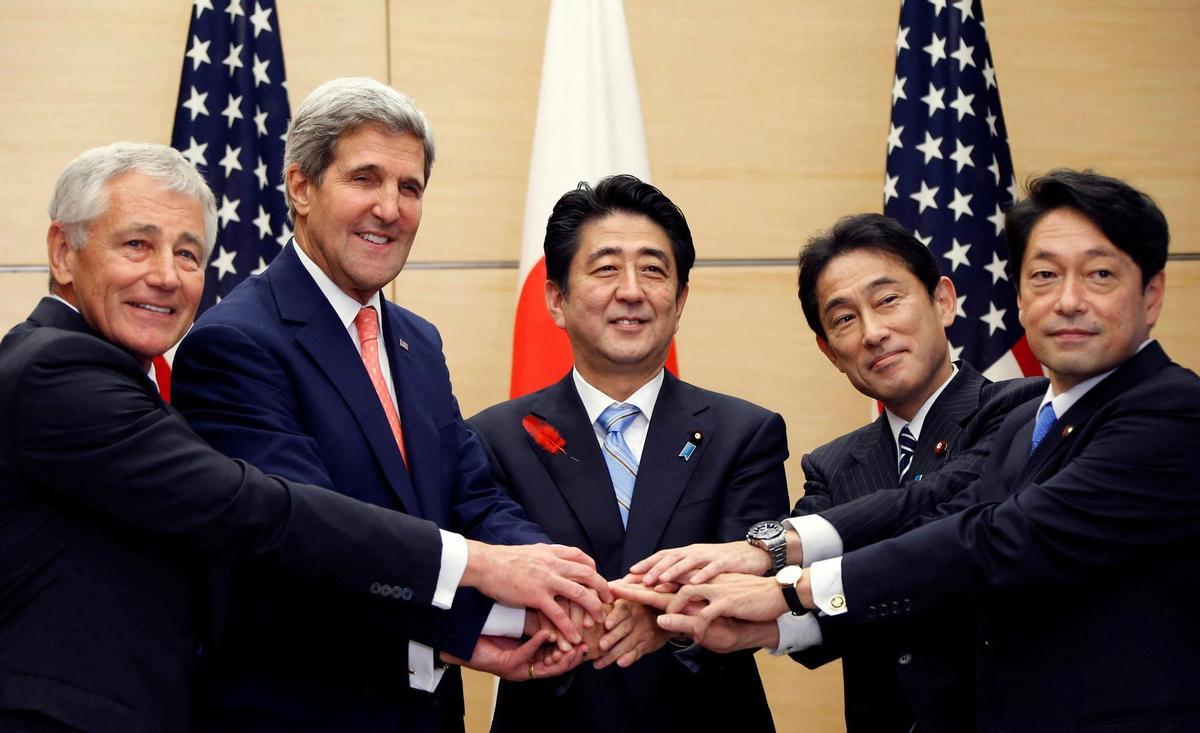 FILE PHOTO: U.S. Defense Secretary Hagel, U.S. Secretary of State Kerry, Japans PM Abe, Japans Foreign Minister Kishida and Japans Defense Minister Onodera pose for photos during their meeting in Tokyo