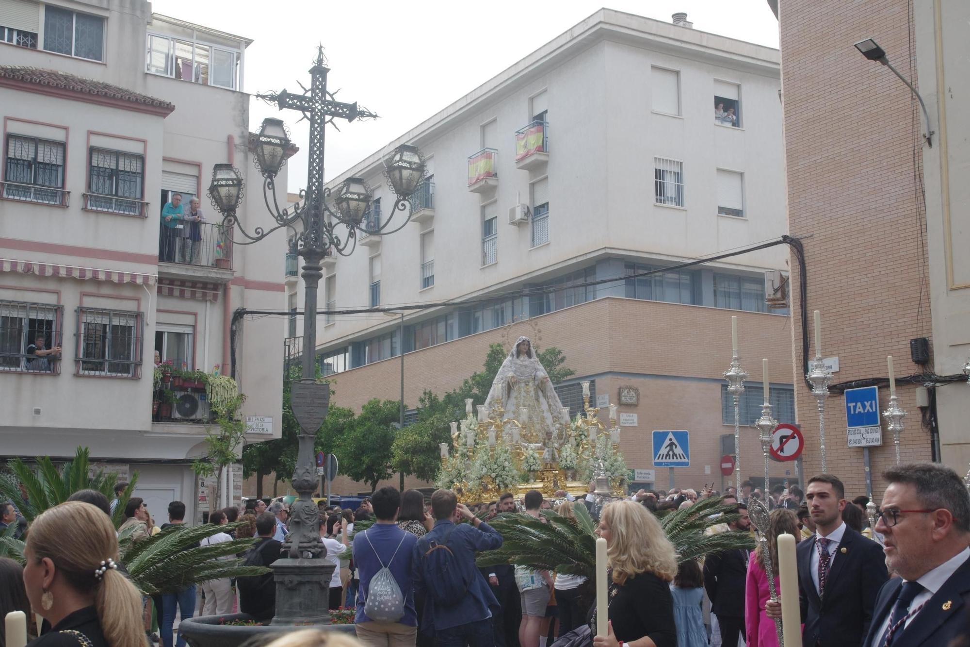 La procesión de la Virgen del Rocío por la Victoria y Lagunillas, en imágenes