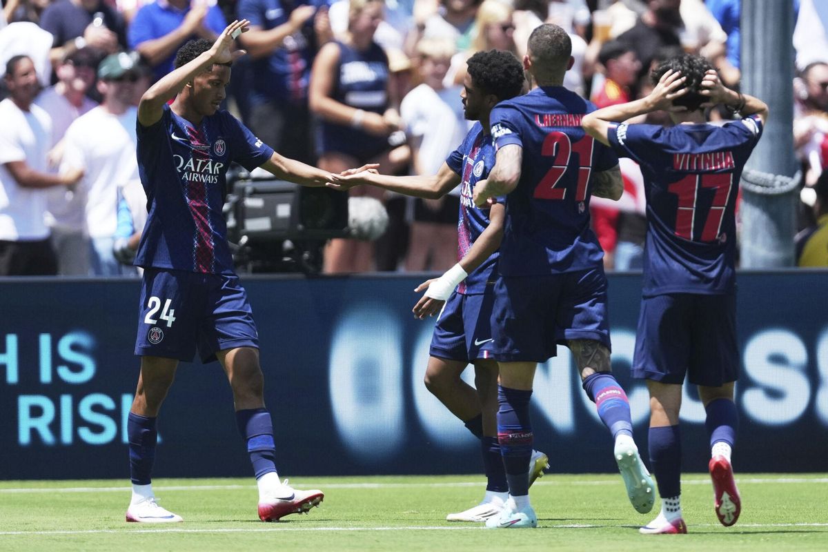 Paris Saint-Germains Senny Mayulu (24) celebrates with teammates after scoring his sides third goal during the Club World Cup group B soccer match between PSG and Atletico Madrid in Pasadena, Calif., Sunday, June 15, 2025. (AP Photo/Jae Hong)