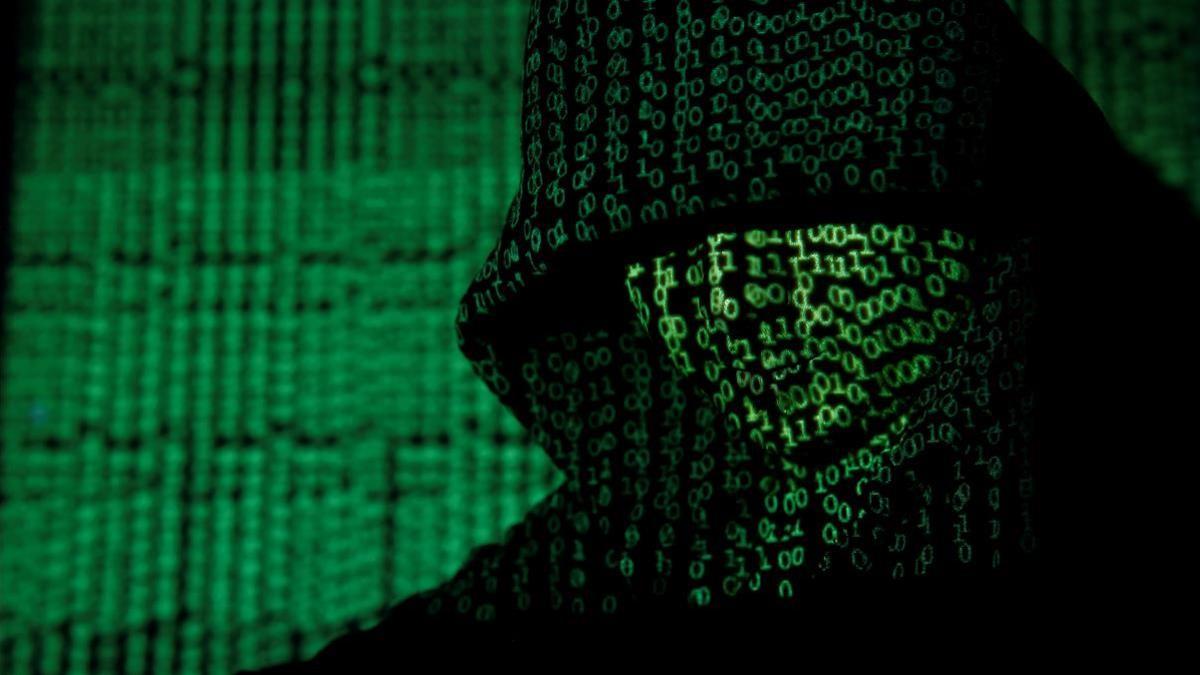 A projection of cyber code on a hooded man is pictured in this illustration picture taken on May 13   2017  Capitalizing on spying tools believed to have been developed by the U S  National Security Agency  hackers staged a cyber assault with a self-spreading malware that has infected tens of thousands of computers in nearly 100 countries  REUTERS Kacper Pempel Illustration     TPX IMAGES OF THE DAY