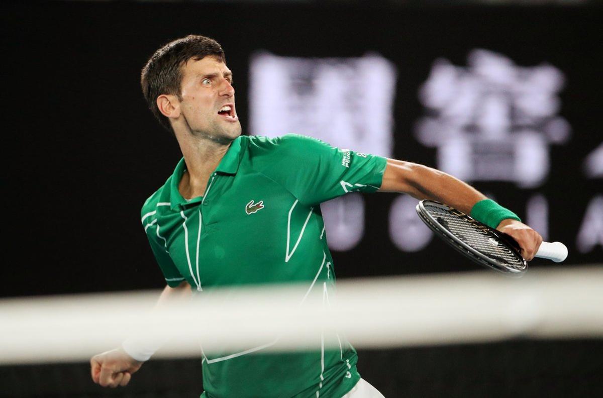 Tennis - Australian Open - Semi Final - Melbourne Park, Melbourne, Australia - January 30, 2020. Serbia’s Novak Djokovic reacts during his match against Switzerland’s Roger Federer. REUTERS/Hannah Mckay