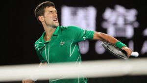 Tennis - Australian Open - Semi Final - Melbourne Park, Melbourne, Australia - January 30, 2020. Serbia’s Novak Djokovic reacts during his match against Switzerland’s Roger Federer. REUTERS/Hannah Mckay