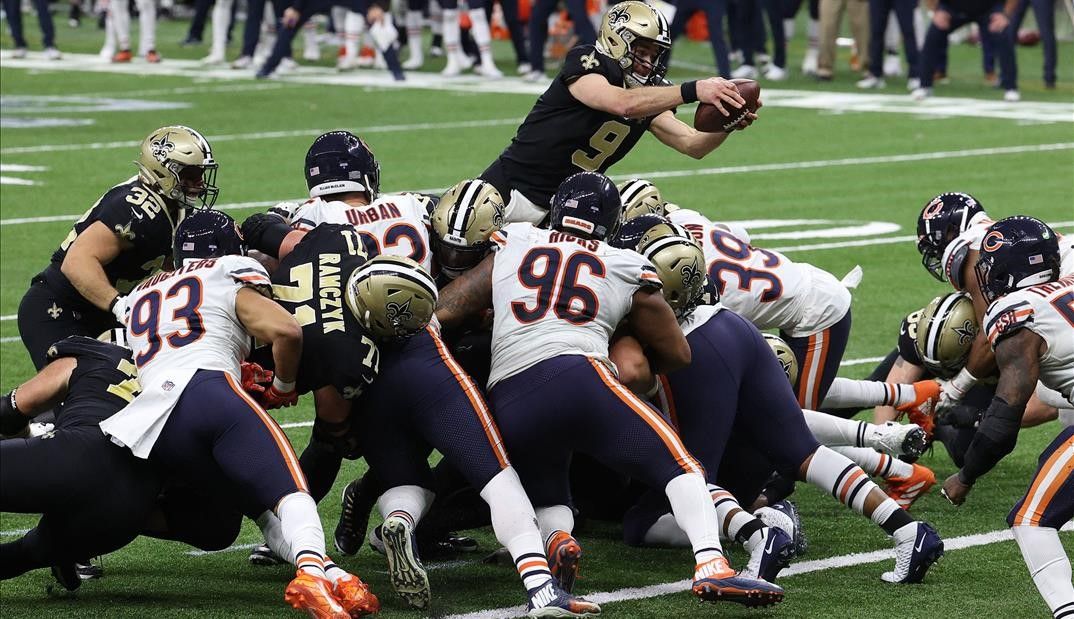 NEW ORLEANS  LOUISIANA - JANUARY 10  Drew Brees  9 of the New Orleans Saints dives in the end zone to score a one yard touchdown against the Chicago Bears during the fourth quarter in the NFC Wild Card Playoff game at Mercedes Benz Superdome on January 10  2021 in New Orleans  Louisiana    Chris Graythen Getty Images AFP    FOR NEWSPAPERS  INTERNET  TELCOS   TELEVISION USE ONLY