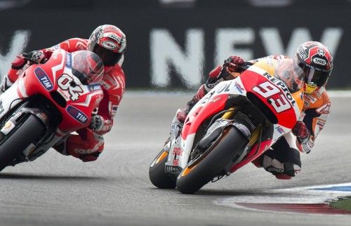 Honda MotoGP rider Marquez of Spain, followed by Ducati MotoGP rider Dovizioso of Italy, takes a curve during the Dutch Grand Prix in Assen