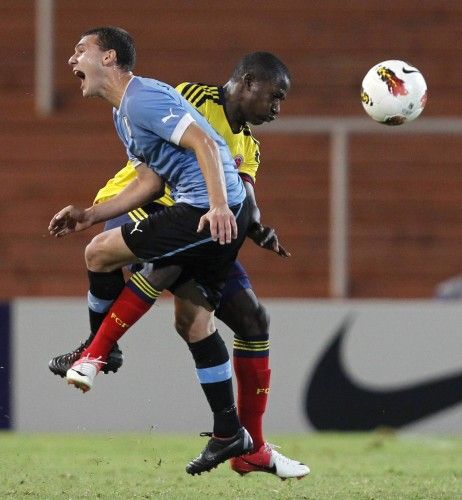 Uruguay's Cristoforo and Colombia's Castillo clash during their South American under-20 championship soccer match in Mendoza