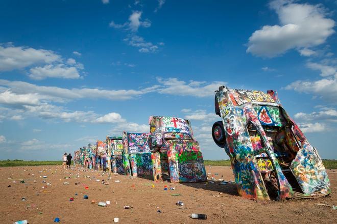 Ruta 66 Row of brightly painted Cadillacs in the Cadillac Ranch in Amarillo, Texas, USA.