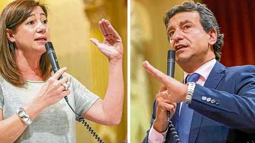 La presidenta del Govern, la socialista Francina Armengol y el líder del PP, Biel Company, durante el tenso cara a cara que mantuvieron ayer en el pleno del Parlament.