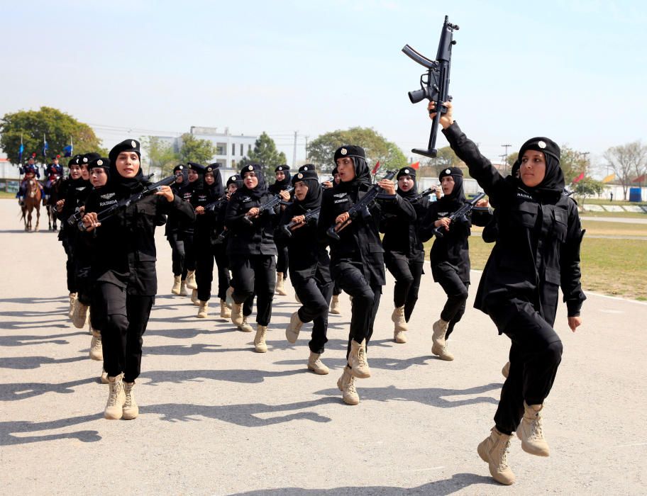 Female members of police commando march during a ...