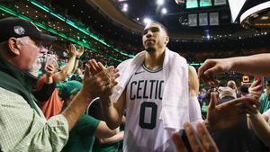 BOSTON, MA - MAY 23: Jayson Tatum #0 of the Boston Celtics high fives fans after defeating the Cleveland Cavaliers 96-83 in Game Five of the 2018 NBA Eastern Conference Finals at TD Garden on May 23, 2018 in Boston, Massachusetts. NOTE TO USER: User expressly acknowledges and agrees that, by downloading and or using this photograph, User is consenting to the terms and conditions of the Getty Images License Agreement.   Adam Glanzman/Getty Images/AFP