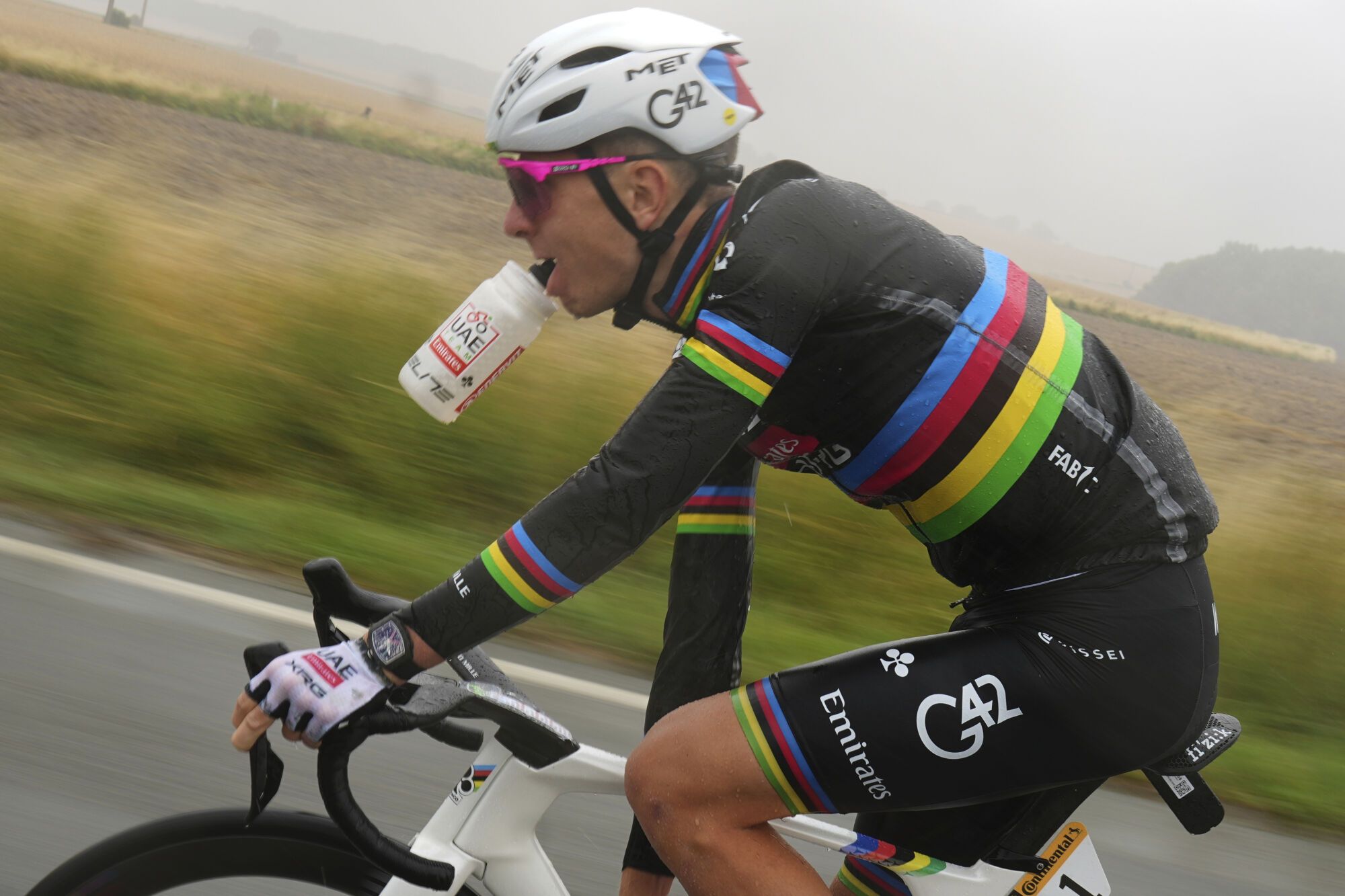 Slovenia's Tadej Pogacar drinks as he rides during the second stage of the Tour de France cycling race over 209.1 kilometers (129.9 miles) with start in Lauwin-Planque and finish in Boulogne-sur-Mer, France, Sunday, July 6, 2025. (AP Photo/Thibault Camus). EDITORIAL USE ONLY/ONLY ITALY AND SPAIN