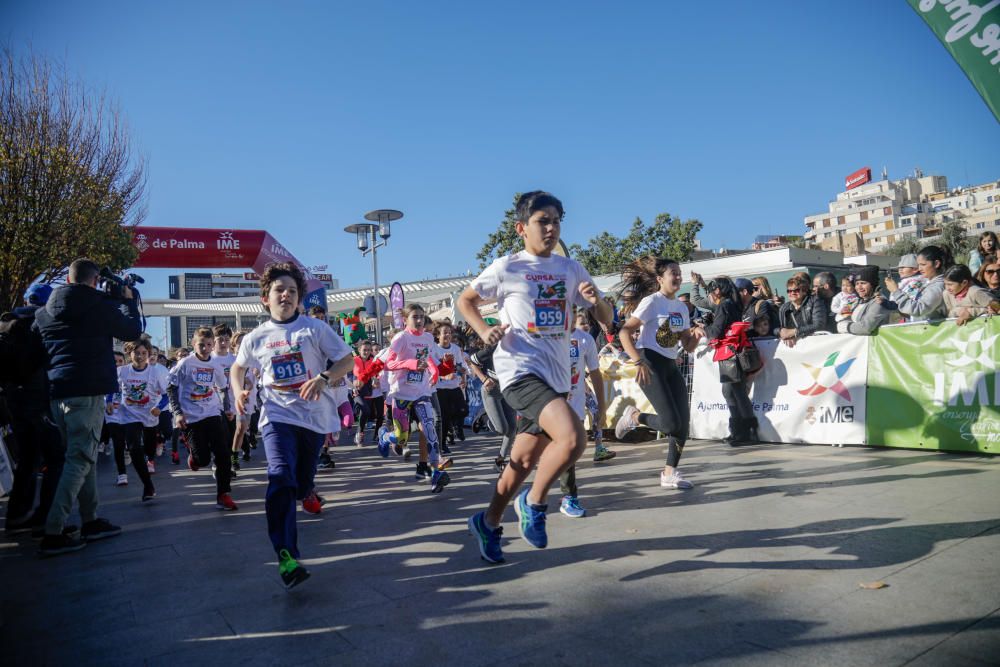 Mil niños y niñas participan en la carrera infantil de Reyes en Palma