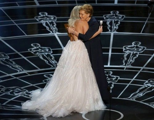 Julie Andrews hugs Lady Gaga after she performed songs from the Sound of Music at the 87th Academy Awards in Hollywood, California