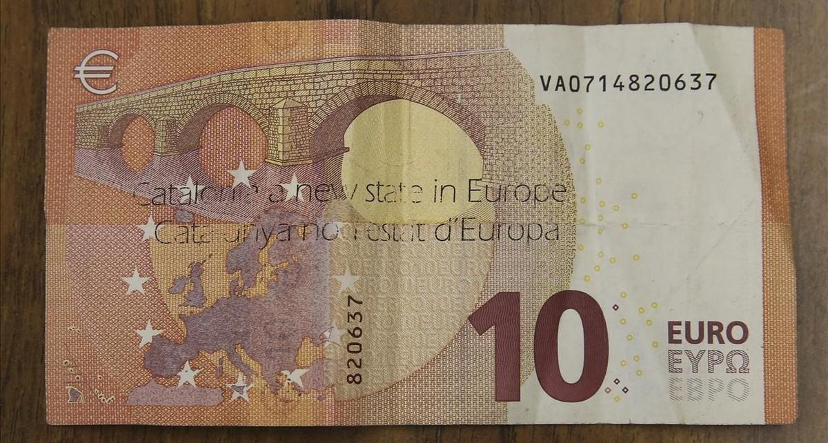 zentauroepp40848684 billete de 10 euros con una marca con un escrito que dice ca171107101037