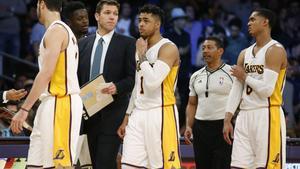Los Angeles Lakers head coach Luke Walton  third left  walks with team members including  from left  forward Larry Nance Jr   forward Julius Randle  guard D Angelo Russell and guard Jordan Clarkson during the second half of an NBA basketball game  Sunday  March 12  2017  in Los Angeles  The 76ers won 118-116   AP Photo Danny Moloshok