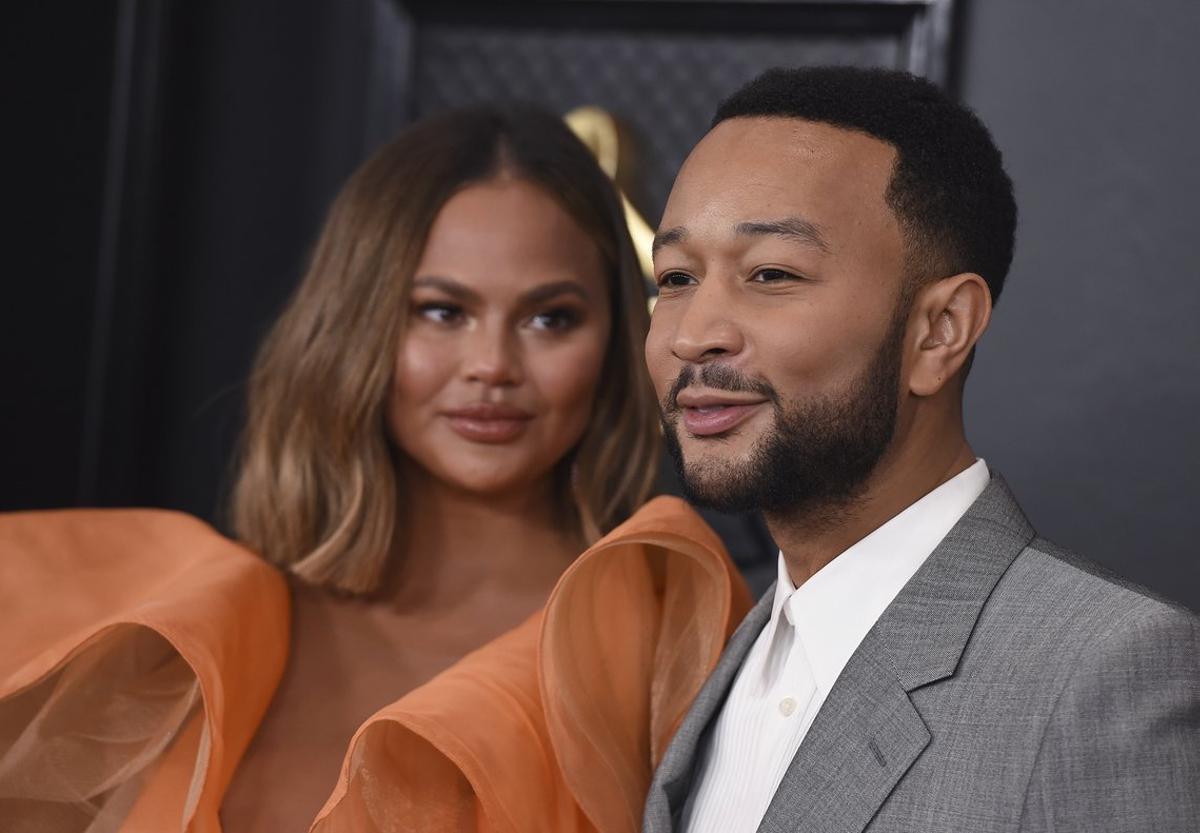 Chrissy Teigen, left, and John Legend arrive at the 62nd annual Grammy Awards at the Staples Center on Sunday, Jan. 26, 2020, in Los Angeles. (Photo by Jordan Strauss/Invision/AP)