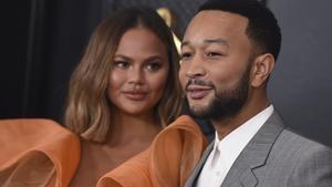 Chrissy Teigen, left, and John Legend arrive at the 62nd annual Grammy Awards at the Staples Center on Sunday, Jan. 26, 2020, in Los Angeles. (Photo by Jordan Strauss/Invision/AP)