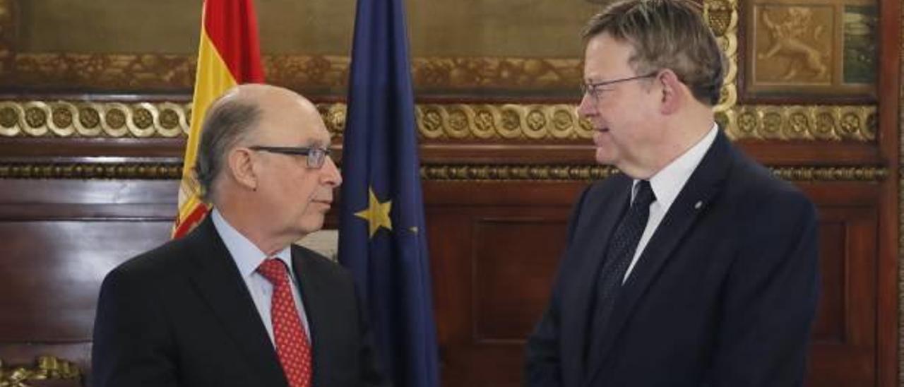 El ministro Montoro, durante el último encuentro con el president Puig para tratar la infrafinanciación valenciana.