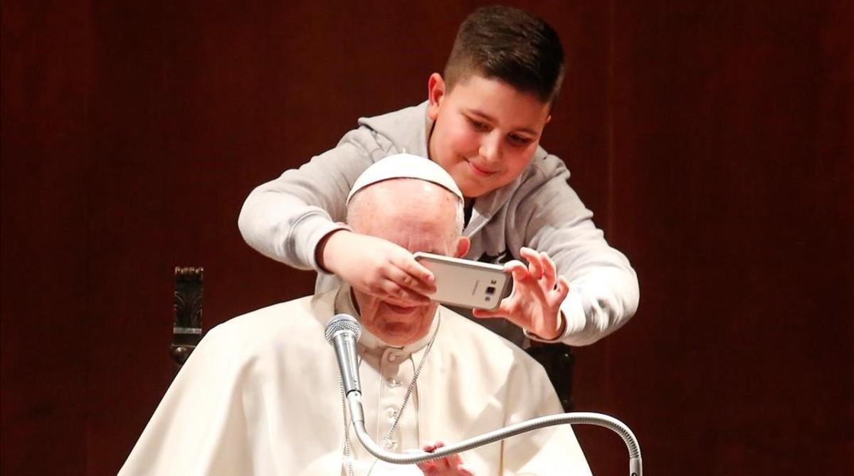 jgblanco37369279 a boy takes selfies with pope francis during a visit at the 170220105117