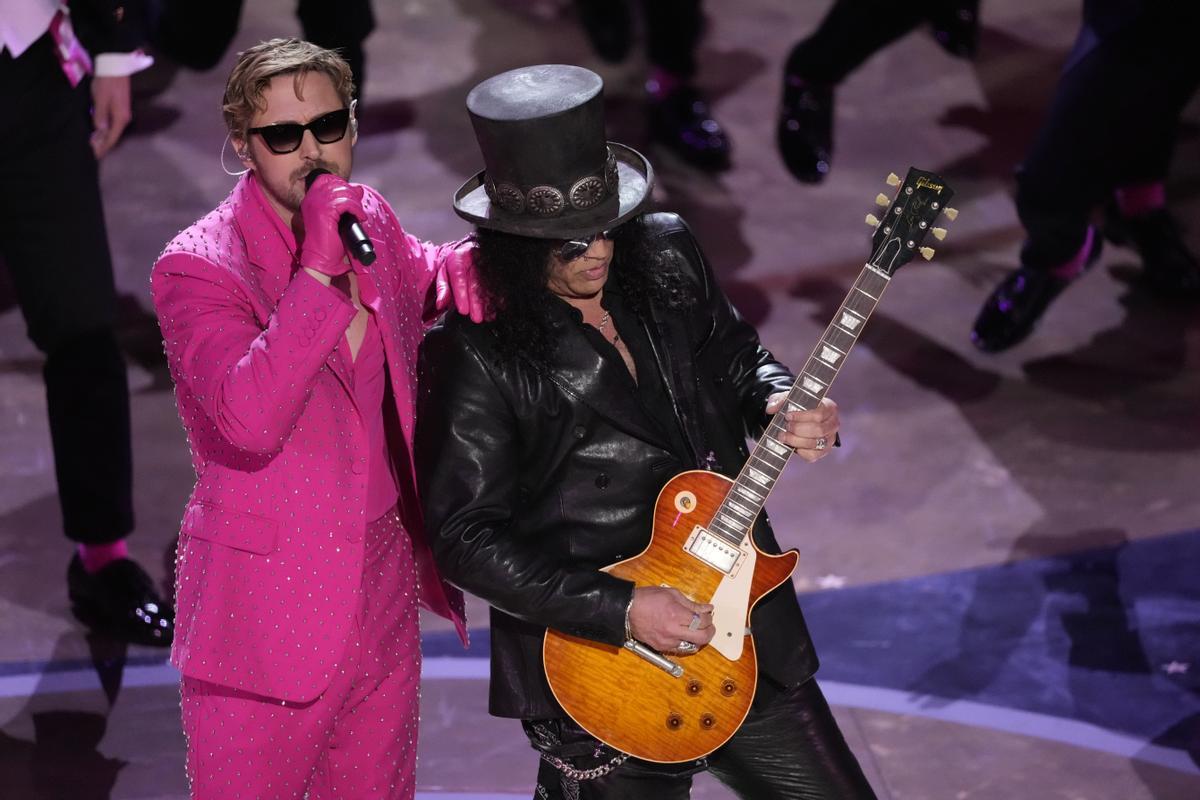 Ryan Gosling, left, performs the song Im Just Ken from the movie Barbie with Slash, right, playing the guitar during the Oscars on Sunday, March 10, 2024, at the Dolby Theatre in Los Angeles. (AP Photo/Chris Pizzello) / 31024130150