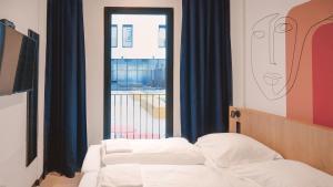 Haitación del Meininger Hotel Barcelona Fira Gran Via