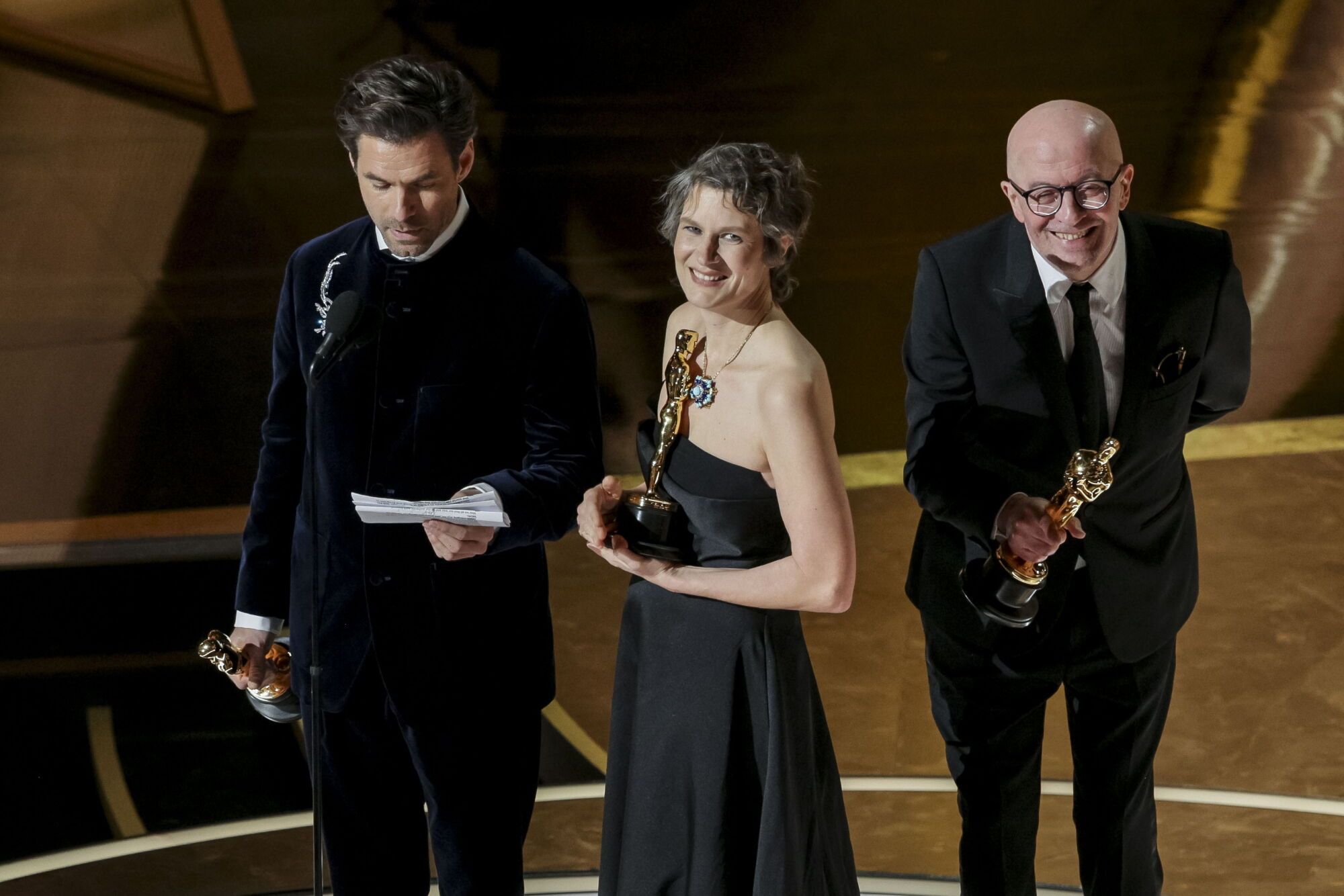 LOS ANGELES (United States), 03/03/2025.- (L-R) Clement Ducol, Camille, and Jacques Audiard accept the Oscar for Best Original Song for 'El Mal' from the film 'Emilia Perez' during the 97th annual Academy Awards ceremony at the Dolby Theatre in the Hollywood neighborhood of Los Angeles, California, USA, 02 March 2025. EFE/EPA/ALLISON DINNER
