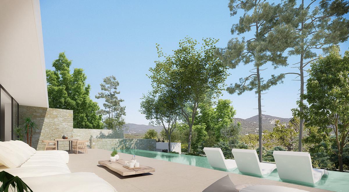 Piscina y terraza inmersas en la naturaleza de una de las villas de lujo en Ibiza.