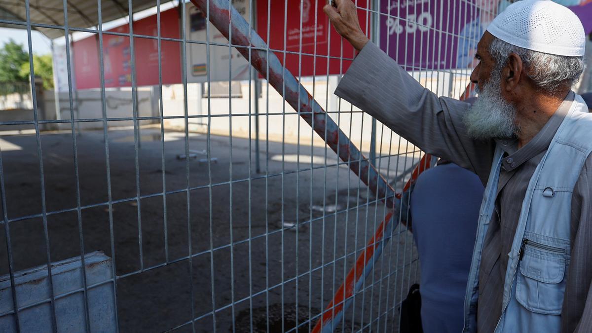 Palestinians with dual citizenship gather outside Rafah border crossing with Egypt