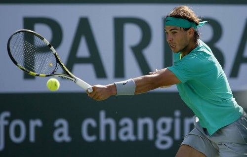 Nadal of Spain returns a shot to Del Potro of Argentina at the BNP Paribas Open ATP tennis tournament in Indian Wells, California